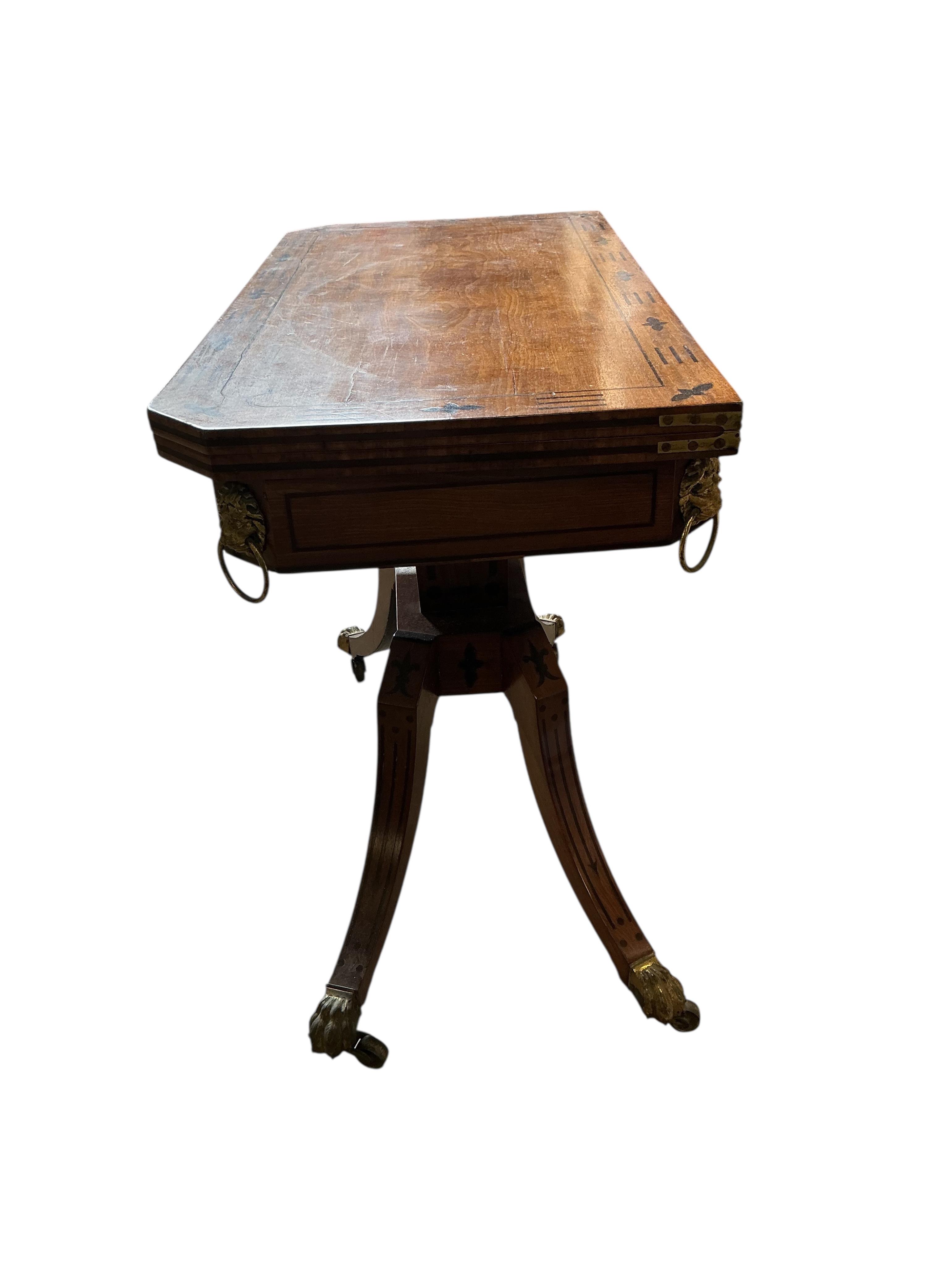A Regency ebony inlaid rectangular mahogany folding card table, width 91cm, depth 45cm, height 74cm